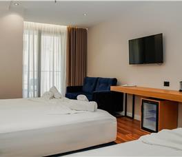 Family room with Double bed, Single bed and Sofa