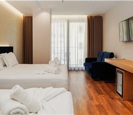 Family room with Double bed, Single bed and Sofa